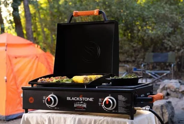 Blackstone camping griddle set up at a campsite