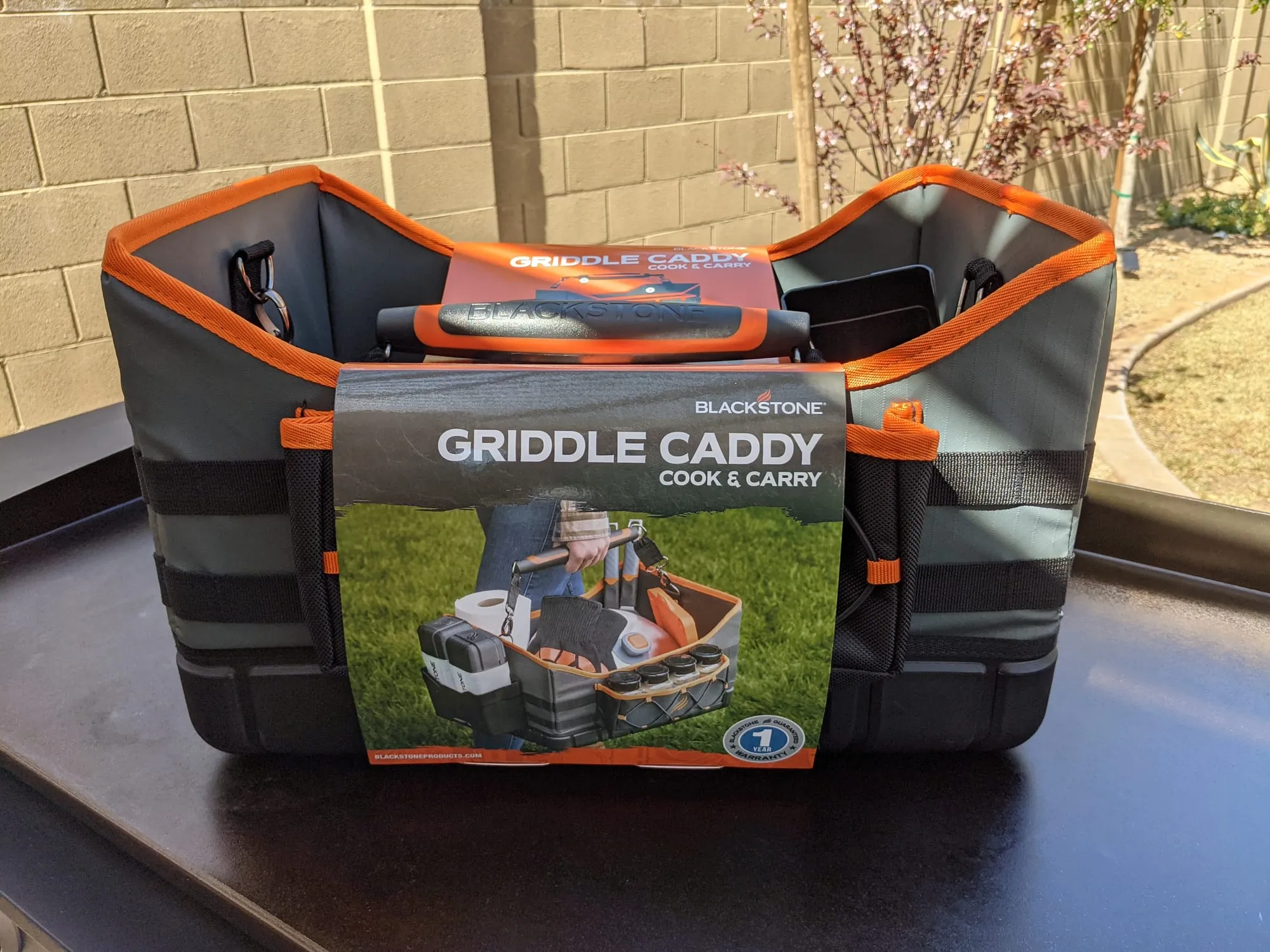 Blackstone griddle caddy tool holder keeping spatulas, scrapers, and accessories organized at the station