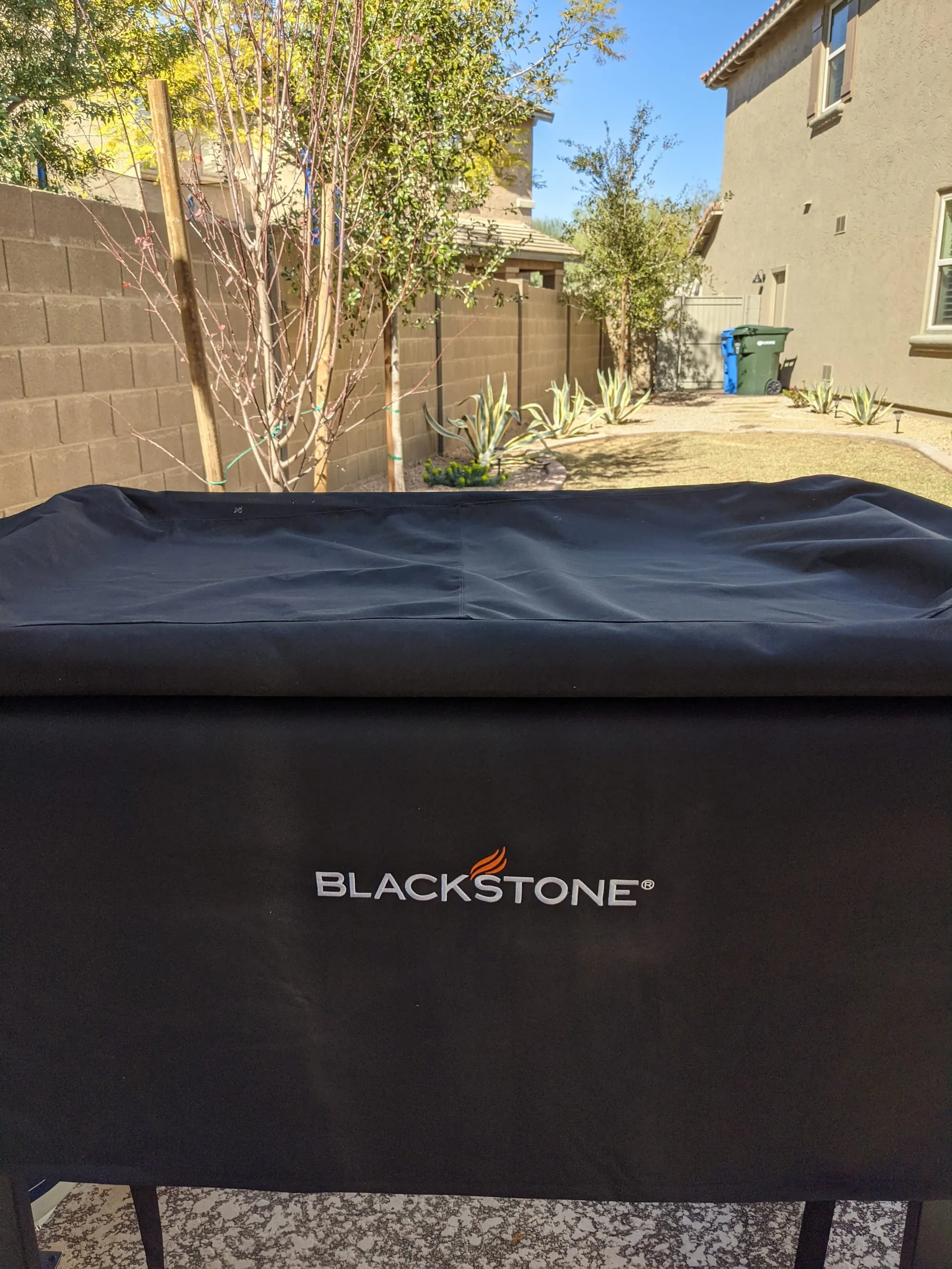 Blackstone griddle under a fitted weather cover
