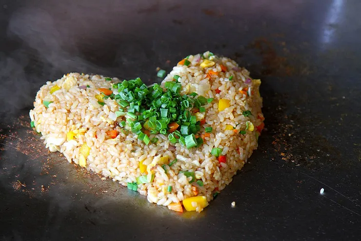 Hibachi fried rice cooking on a Blackstone griddle
