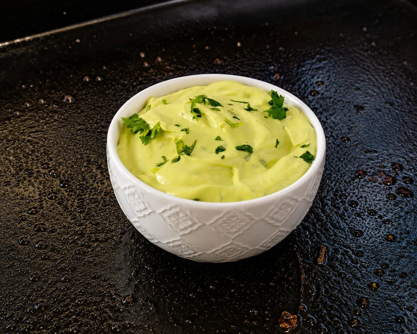 Smooth avocado crema with lime and cilantro for Blackstone tacos and fajitas