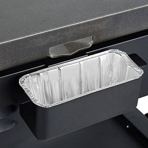 Disposable foil drip tray liner inside a Blackstone grease trap